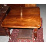 A 19th Century mahogany wind-out dining table with centre leaf and handle, on turned and reeded