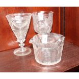 A 19th Century goblet with conical bowl cut swags, another goblet with engraved band of vines and