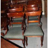 A set of six early 19th Century mahogany dining chairs with plain shoulder boards and back rails,