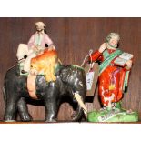 An early 19th Century Staffordshire figure of St Matthew and another figure of an elephant with a