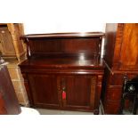 An early 19th Century rosewood chiffonier, back fitted shelf on "S" supports, base fitted two frieze