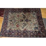 An antique Caucasian rug decorated all-over stylised floral design with three script medallions on a