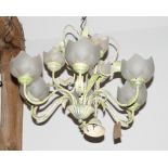 A cream and green painted metal eight-light pendant centre light fitted flower form frosted glass