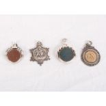 Two 19th Century silver and bloodstone fob spinners and two silver sporting medals