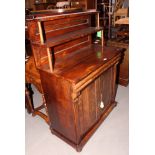 An early 19th Century mahogany chiffonier, fitted two shelves over base fitted frieze drawer and