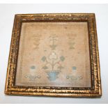 A 19th Century miniature needlepoint sampler decorated floral motifs, 5" x 5", in gilt frame
