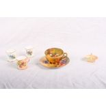 A Royal Worcester cabinet cup and saucer painted fruit by E Townsend, three miniature Worcester mugs