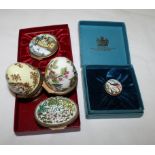 Three Bilston & Battersea enamelled Christmas boxes and two similar egg-shaped boxes