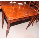 A 19th Century mahogany rectangular fold-over top card table inset circular baize panel, on turned