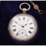 A silver cased open faced key wind pocket watch with white enamel dial and subsidiary seconds