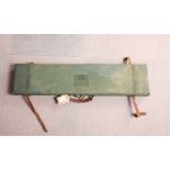 A shot gun carrying case covered canvas painted green