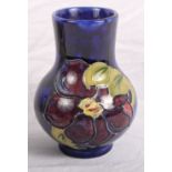 A Moorcroft bulbous vase with clematis decoration, 4" high