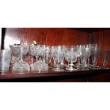 A collection of assorted cut and engraved drinking glasses