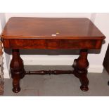 A Victorian mahogany centre table, fitted two drawers, on faceted twin column supports, 40" wide