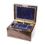 A lady's 19th Century coromandel dressing box, fitted interior with glass bottles, two concealed