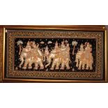 A Thai stump work type panel of figures on three elephants, 29" x 60", in gilt frame