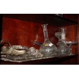 A silver plated two-handled tray, a glass trinket tray and three glass decanters, etc