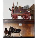 A wooden model of a dray and three pottery horses