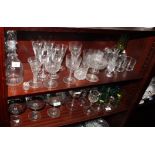 Two decanters, a cut glass water jug and a large collection of assorted drinking glasses