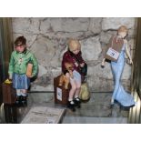 A pair of Royal Doulton limited edition china figures, boy and girl evacuees, HN3202 and HN3203 with