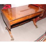 An early 19th Century mahogany sofa table, fitted frieze drawers with panelled fronts, on twin