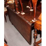 A late 18th Century mahogany drop leaf table with single flap, on square chamfered supports, 46"
