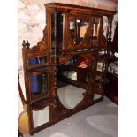 An Edwardian inlaid rosewood overmantel mirror with central shield-shaped bevelled mirror panel,