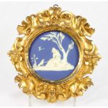 An 18th Century Wedgwood circular blue jasperware plaque depicting Poor Maria and her dog Sylvio