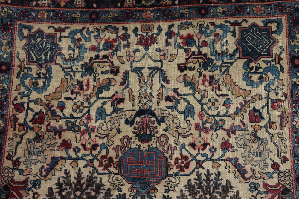 An antique Caucasian rug decorated all-over stylised floral design with three script medallions on a - Image 2 of 3
