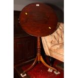 A 19th Century fruitwood circular tilt top occasional table, on fruitwood tripod base, 21" dia