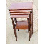 A set of three Edwardian mahogany and satinwood banded occasional tables, on square supports, 16"