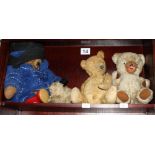 A mid 20th Century gold plush teddy bear, a Paddington bear, another teddy bear and a dog