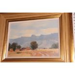 Marge Maggs: oil on canvas, landscape with buildings and distant mountains, 8" x 12", in gilt frame