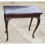 A Victorian fold-over top card table with serpentine edges, on cabriole supports, 31" wide