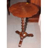 A 19th Century mahogany occasional table with carved pie crust edge, on tripod base