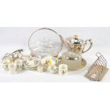 A doll's Crown Ducal tea set decorated nursery rhyme characters, a silver serviette ring and a