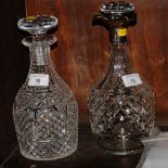 A diamond and panel cut crystal decanter with three-way silver pouring lip and another hobnail cut