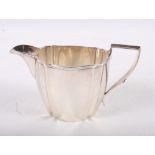 A shaped silver cream jug, 4.6oz troy approx