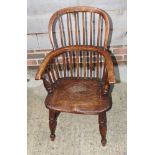 A child's 19th Century Windsor high back armchair, plain spindles to back, on turned underframe