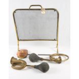 A brass firescreen, two brass car horns, a brass balance and a copper chestnut roaster
