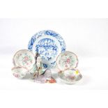 A pair of Chinese famille rose decorated tea bowls, three saucers, a 19th Century oriental blue