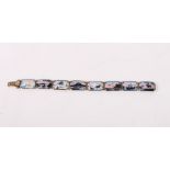 A Scandinavian silver gilt and enamel bracelet decorated various winter landscapes