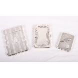 A white metal card case with engine turned decoration, a silver match book holder with RAF wings and
