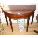 A 19th Century mahogany and box line inlaid semicircular fold-over top tea table, on square taper