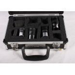 A collection of 1 1/4", 10mm, 17mm, 20mm and 32mm eyepieces, in aluminium case