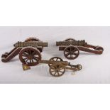 Three scale models of 17th Century siege guns, two on wooden carriages, one on brass, 13" long max