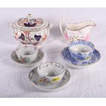 A Miles Mason Willow pattern tea bowl and saucer, two New Hall tea bowls and saucers, an Imari