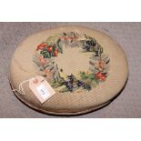 A Victorian oval footstool with floral gros point cover and a folding cake stand