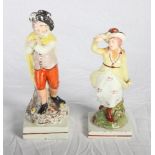 An early 19th Century Staffordshire figure of a man with a cloak, 8" high, and a similar figure of a