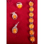 A silver and "amber" parure of bracelet, earrings and ring